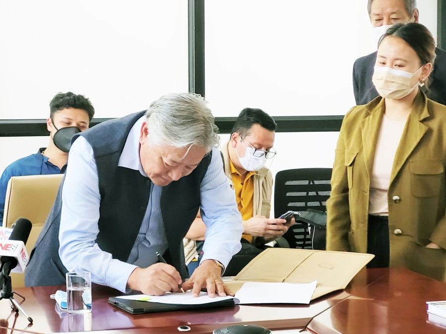 IDAN CEO Alemtemshi Jamir signing the MoU on September 10. (Morung Photo)